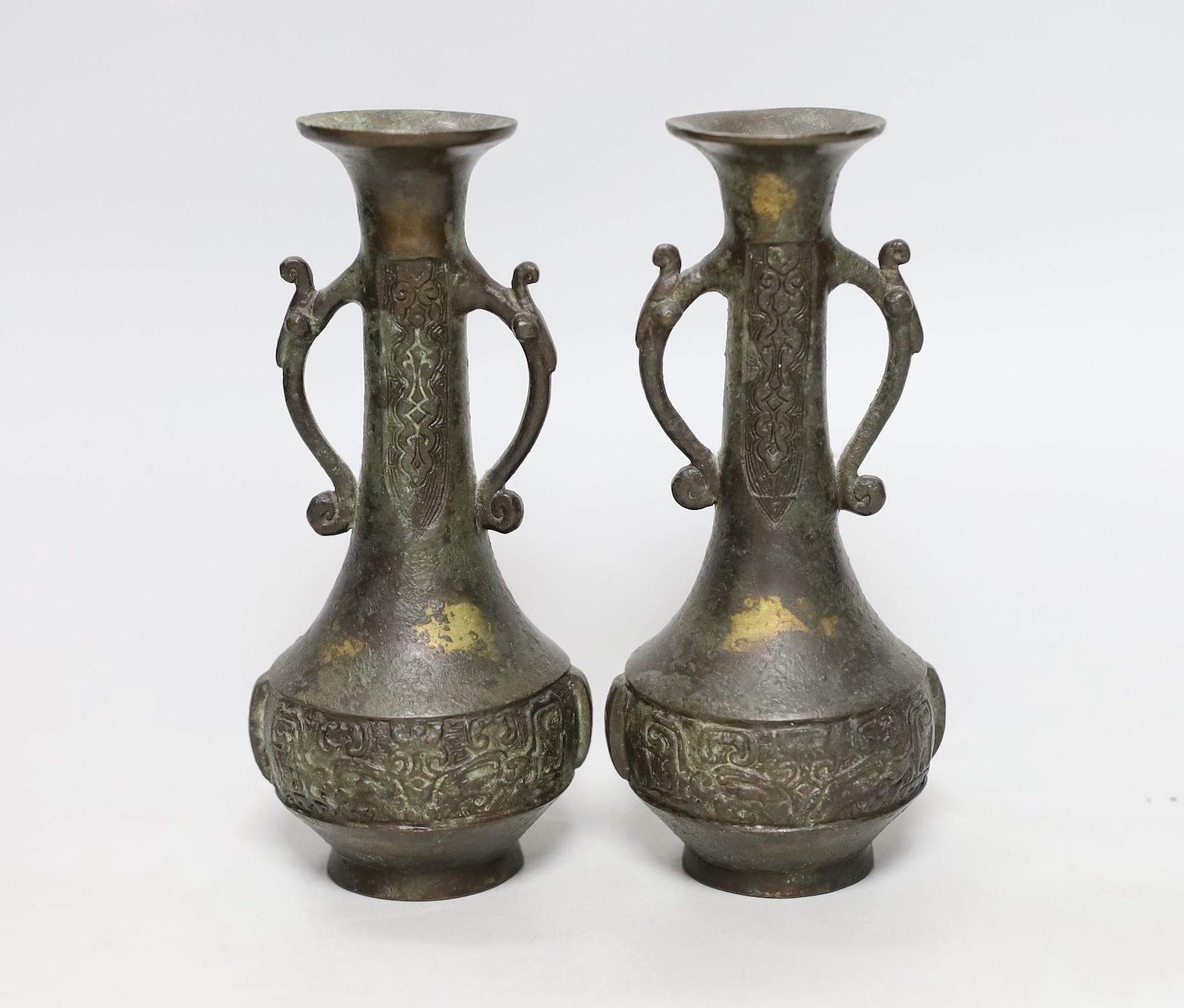 A pair of Chinese two handled bronze bottle vases, late Ming dynasty, 17cm